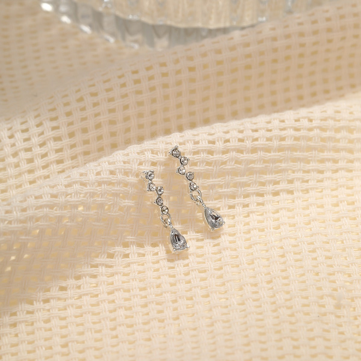 Hot selling diamond inlaid water drop zircon earrings for women's inset style, personalized and simple temperament, high-end feeling, small and exquisite earrings