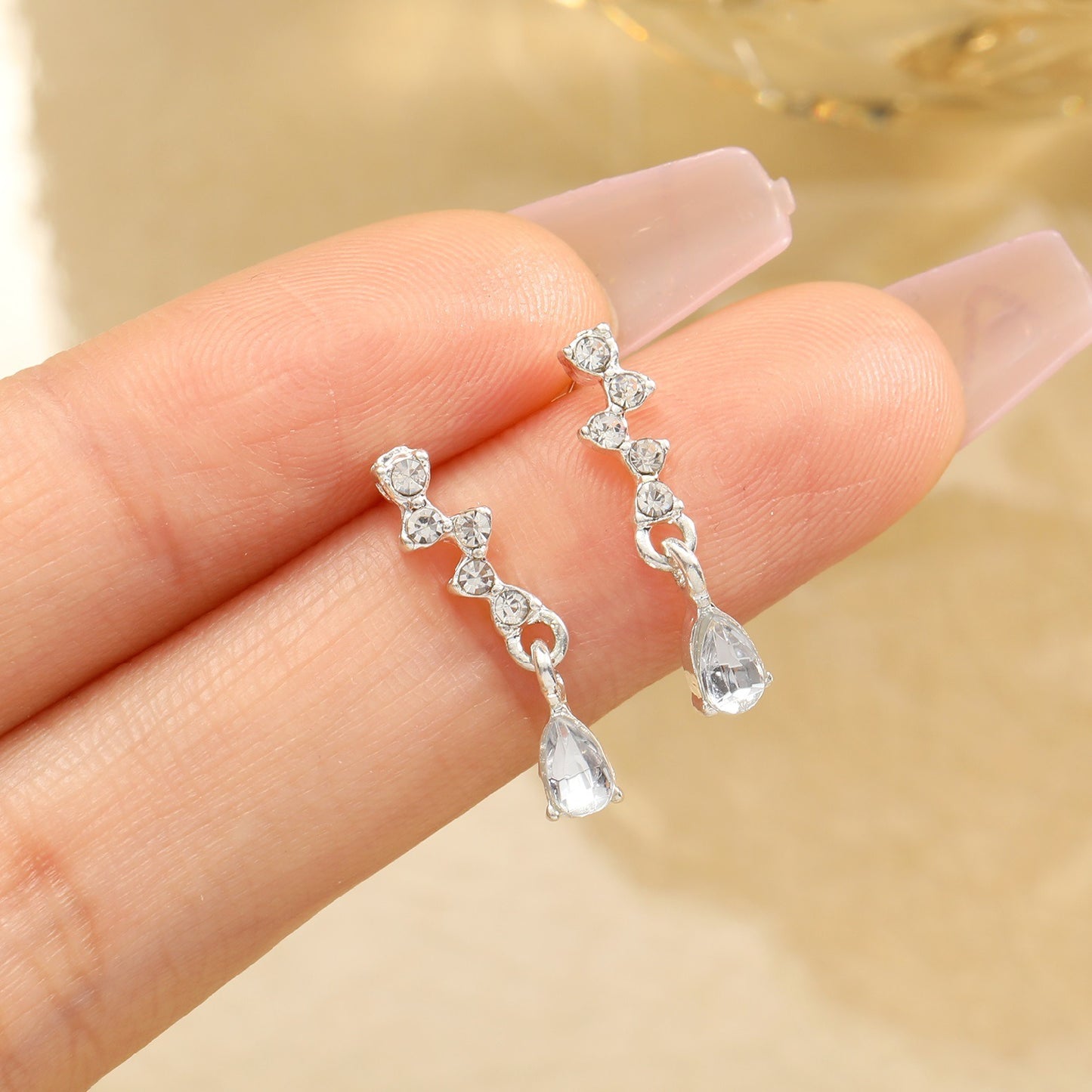 Hot selling diamond inlaid water drop zircon earrings for women's inset style, personalized and simple temperament, high-end feeling, small and exquisite earrings