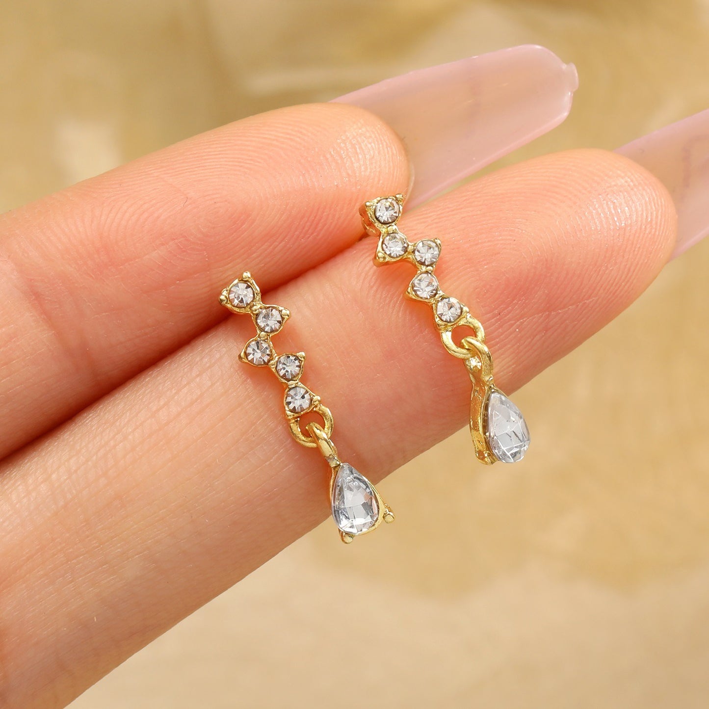 Hot selling diamond inlaid water drop zircon earrings for women's inset style, personalized and simple temperament, high-end feeling, small and exquisite earrings